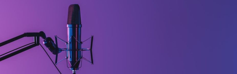 Studio microphone isolated on dark background with neon lighting and space for text
